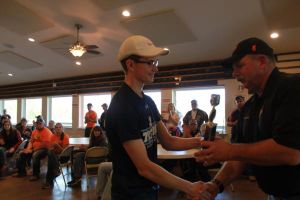 KIM & DOUG WYMAN PRESENTING AWARDS AT the 2017 October Corridor Clay Crushers tournament - 2nd Annual Pheasants Forever shootout hosting 9 collegiate trap teams at Otter Creek in Cedar Rapids Iowa