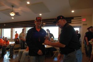 KIM & DOUG WYMAN PRESENTING AWARDS AT the 2017 October Corridor Clay Crushers tournament - 2nd Annual Pheasants Forever shootout hosting 9 collegiate trap teams at Otter Creek in Cedar Rapids Iowa