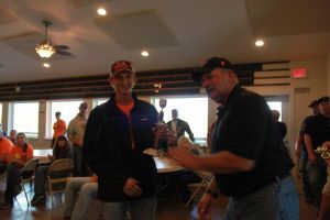 KIM & DOUG WYMAN PRESENTING AWARDS AT the 2017 October Corridor Clay Crushers tournament - 2nd Annual Pheasants Forever shootout hosting 9 collegiate trap teams at Otter Creek in Cedar Rapids Iowa