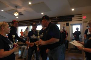 KIM & DOUG WYMAN PRESENTING AWARDS AT the 2017 October Corridor Clay Crushers tournament - 2nd Annual Pheasants Forever shootout hosting 9 collegiate trap teams at Otter Creek in Cedar Rapids Iowa